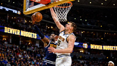 NBA丹佛掘金队尼古拉约基奇篮下进攻的赛事回放画面